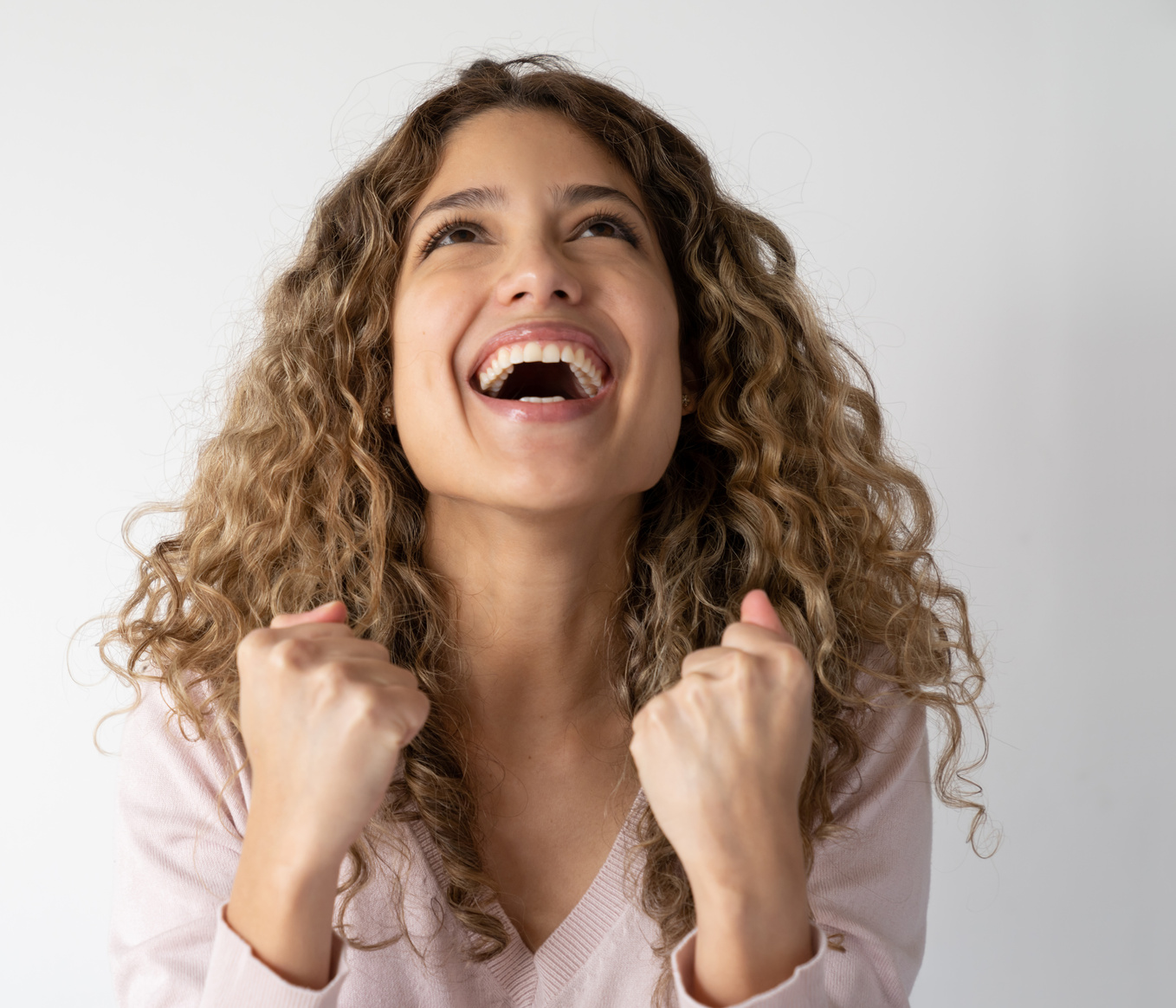 Portrait of an excited woman celebrating an accomplishment