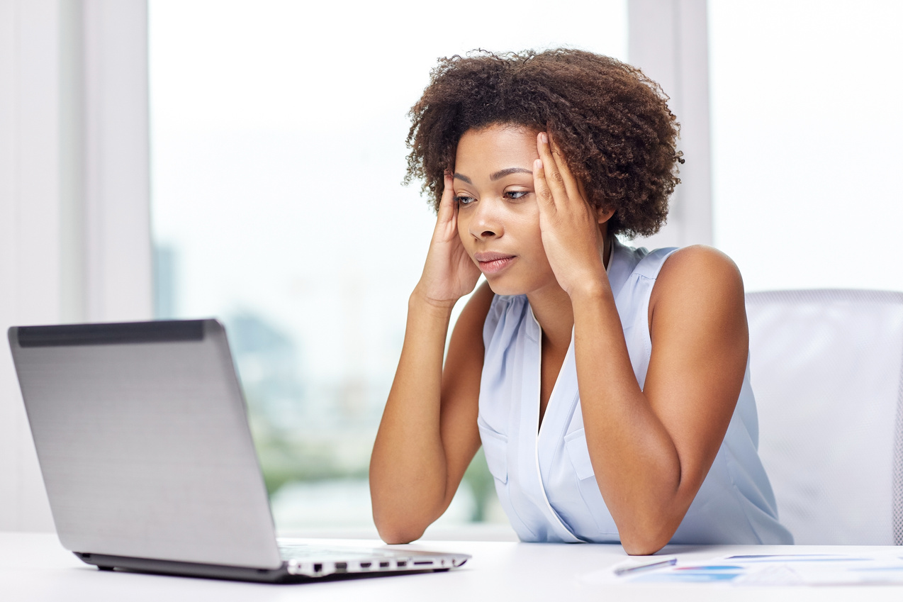 African Woman with Laptop at Office